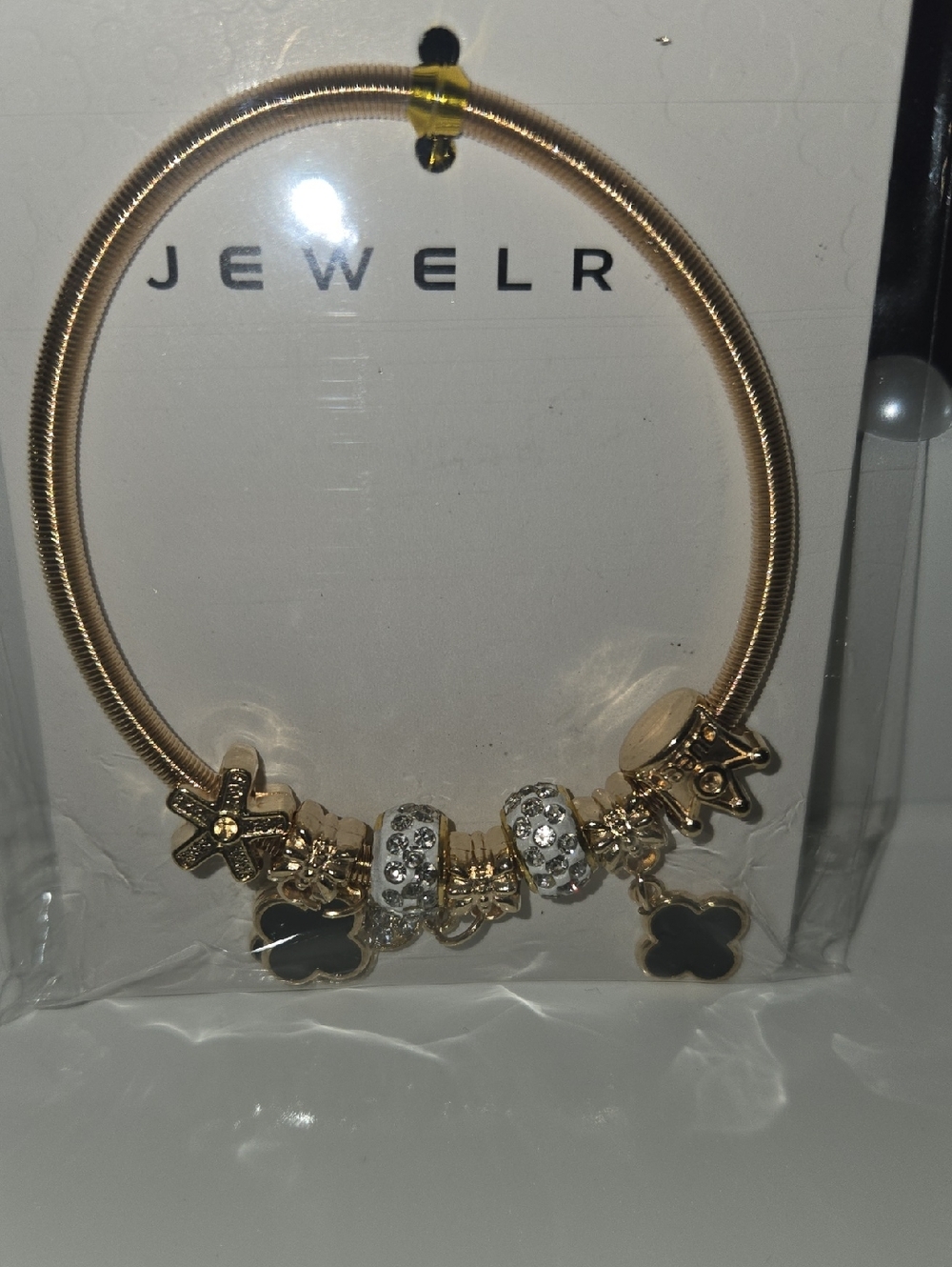 Gold-Tone Charm Bracelet with Black Clover Accents